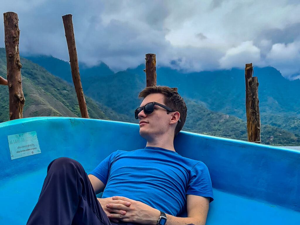 Dan relaxing on the bow of a lancha (boat) on Lake Atitlán, Guatemala.