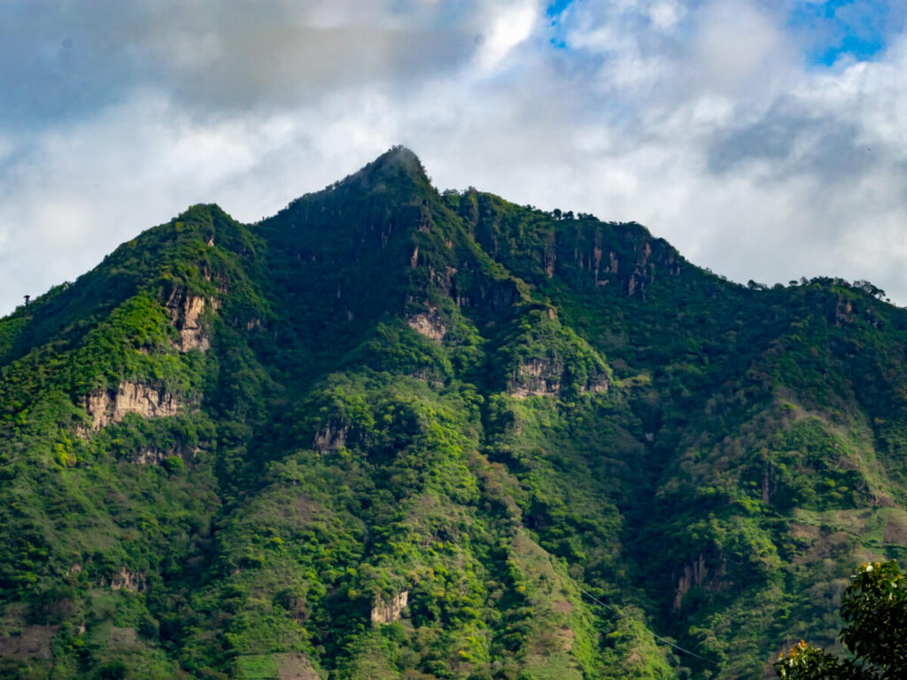El Rostro Maya (Indian Nose), a lush green mountain and the most popular hike in Lake Atitlán.