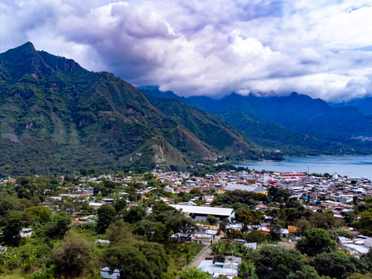 The Maya town of San Juan La Laguna beneath the Indian Nose ridgeline on the shores of the blue Lake Atitlán in Guatemala.
