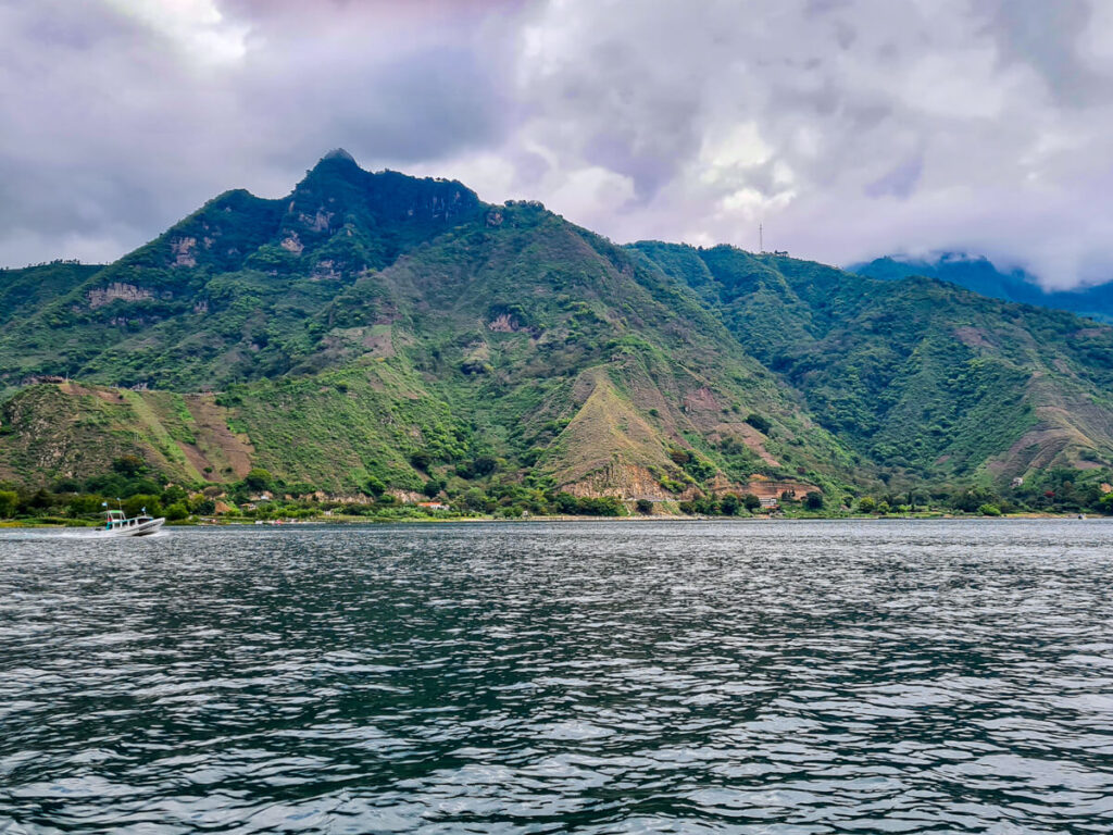 A view of mountains across the waters of Lake Atitlán.