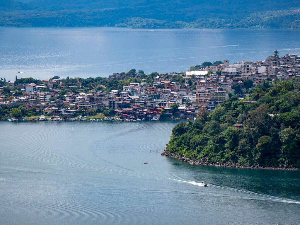 A lancha leaving the hillside town of San Pedro La Laguna, one of the best towns to visit on Lake Atitlán.