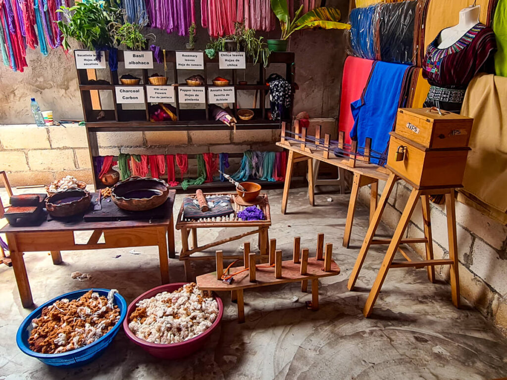 Colourful garments and dyes in a weaving cooperative in San Pedro La Laguna, Lake Atitlán, Guatemala.