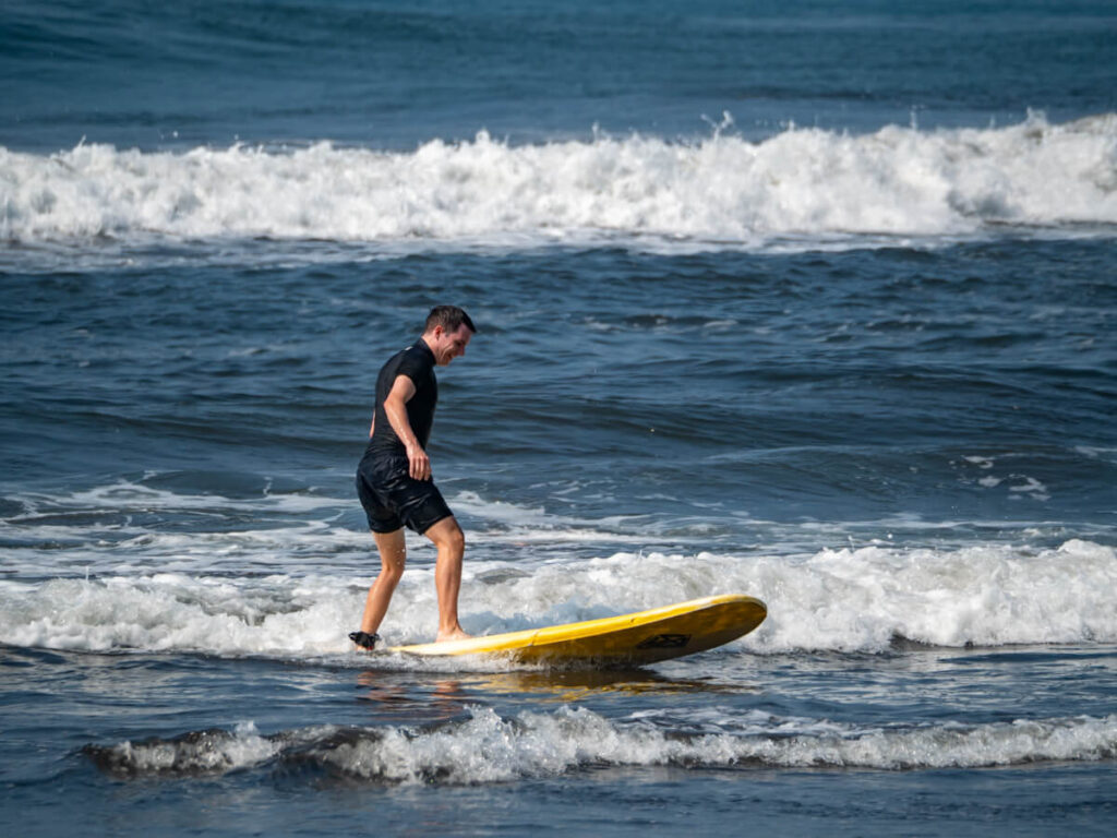 Dan surfing the waves in El ParedĂłn, Guatemala.