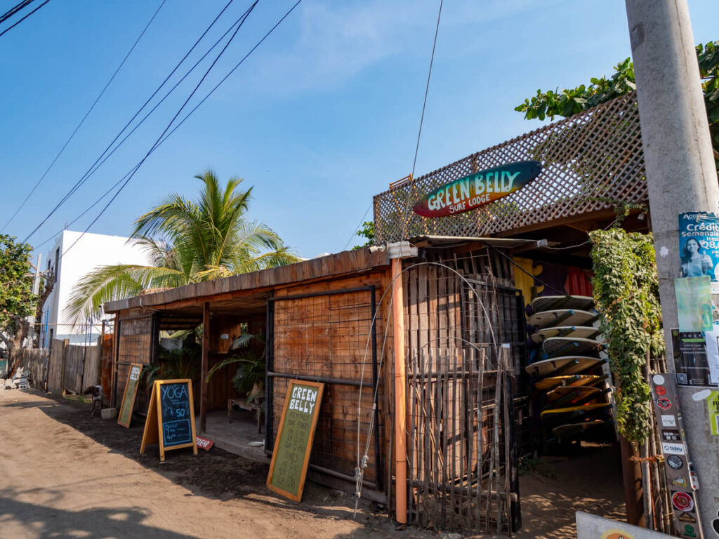 Surfboard stacked up outside Green Belly Surf Lodge, one of the best hostels in El Paredón, Guatemala.