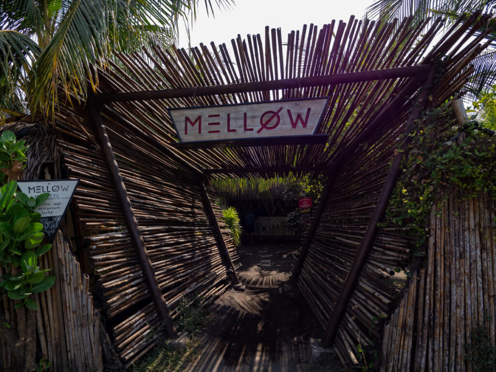 An elaborately sculpted wooden entrance to Mellow Hostel in El Paredón, Guatemala.