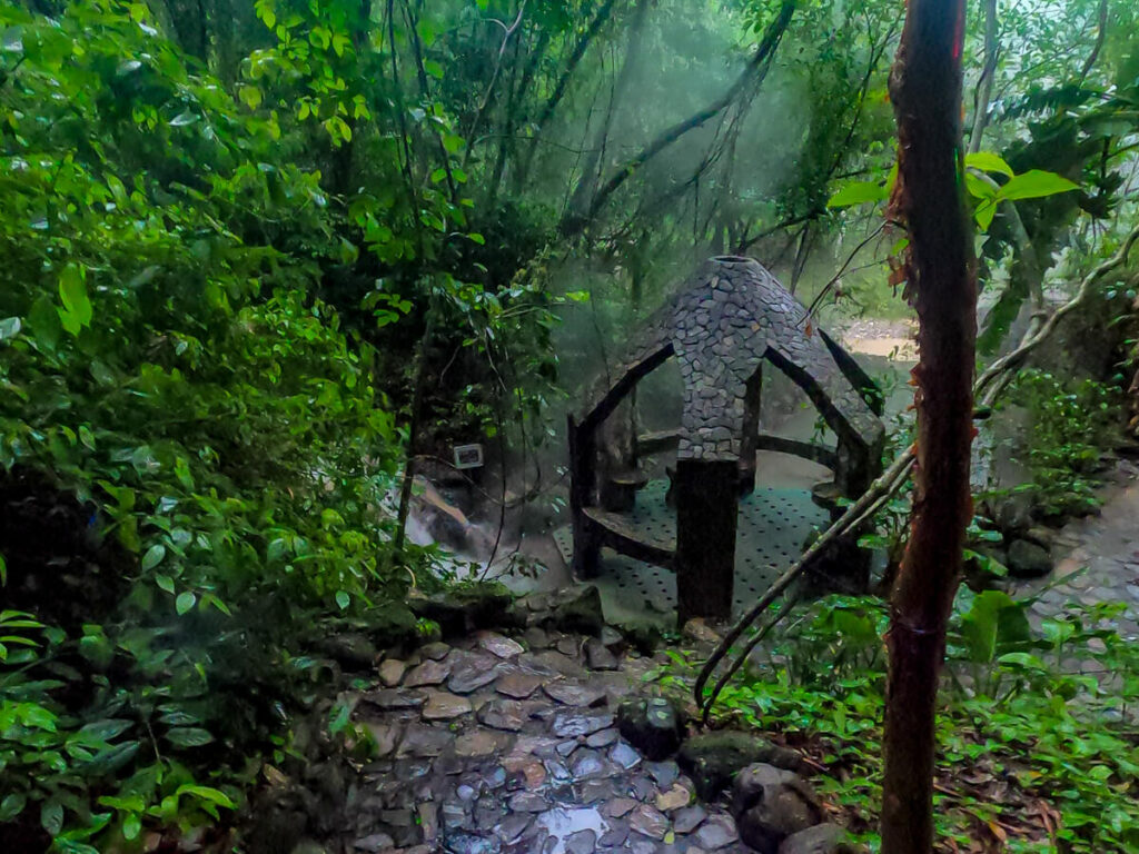 A cobbled pathway leading to a stone hut in Luna Jaguar Spa, near Copán Ruinas, Honduras.