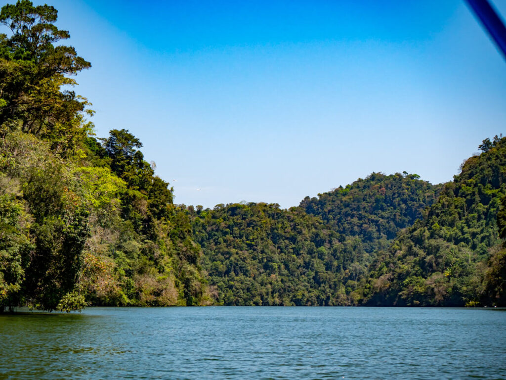 A wide river lined with lush greenery in RĂo Dulce.