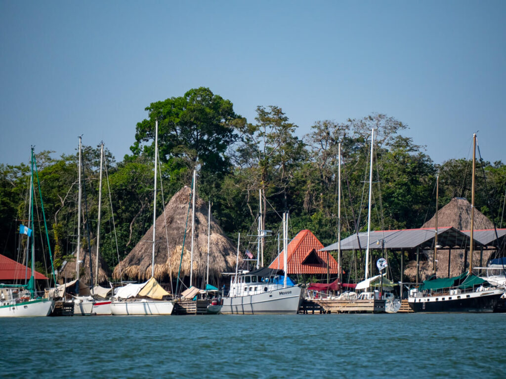 Yachts moored along the riverside in Río Dulce.
