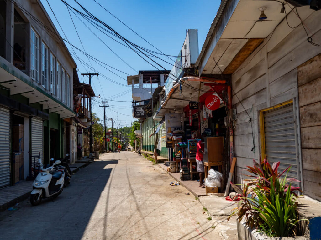 A street lined with houses in Livingston, Guatemala.