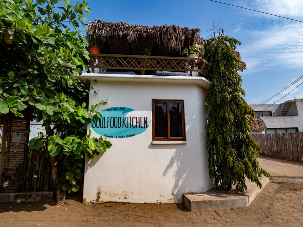 The whitewashed wall of Soul Food Kitchen, a popular restaurant in El Paredón, Guatemala.