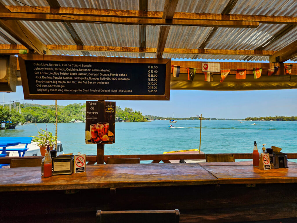 A bar with a view of the Río Dulce in Sundog restaurant.