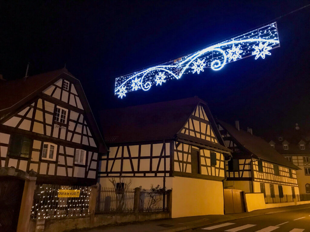 A hanging banner of Christmas lights in Wolfisheim.