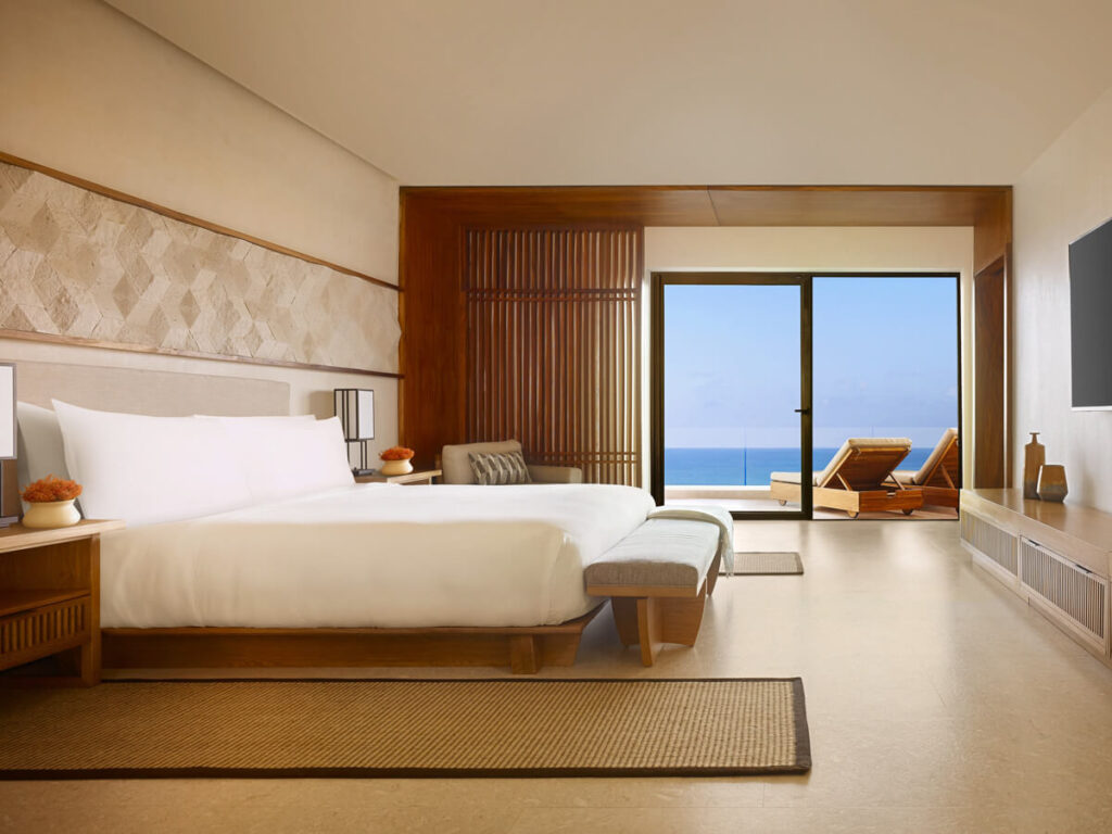 A pristine bedroom with huge bed and sea views in Nobu Hotel in Cabo San Lucas.