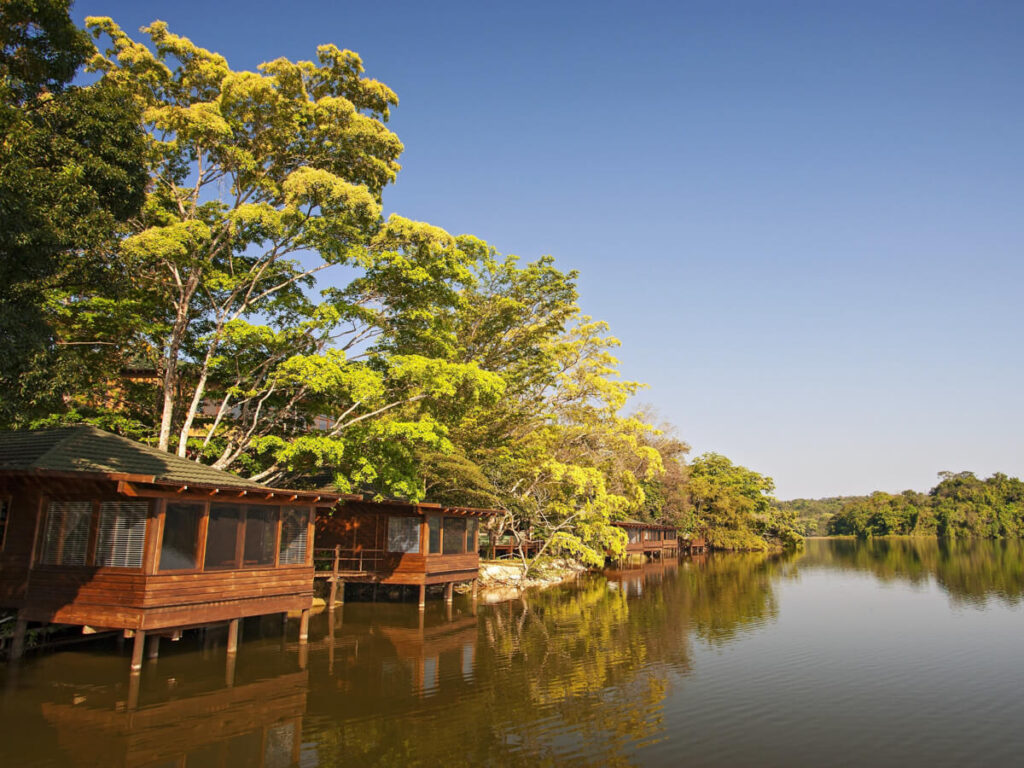 A luxury wooden cabin on the lakefront surrounded by jungle at Las Lagunas Boutique Hotel near Flores, Guatemala.