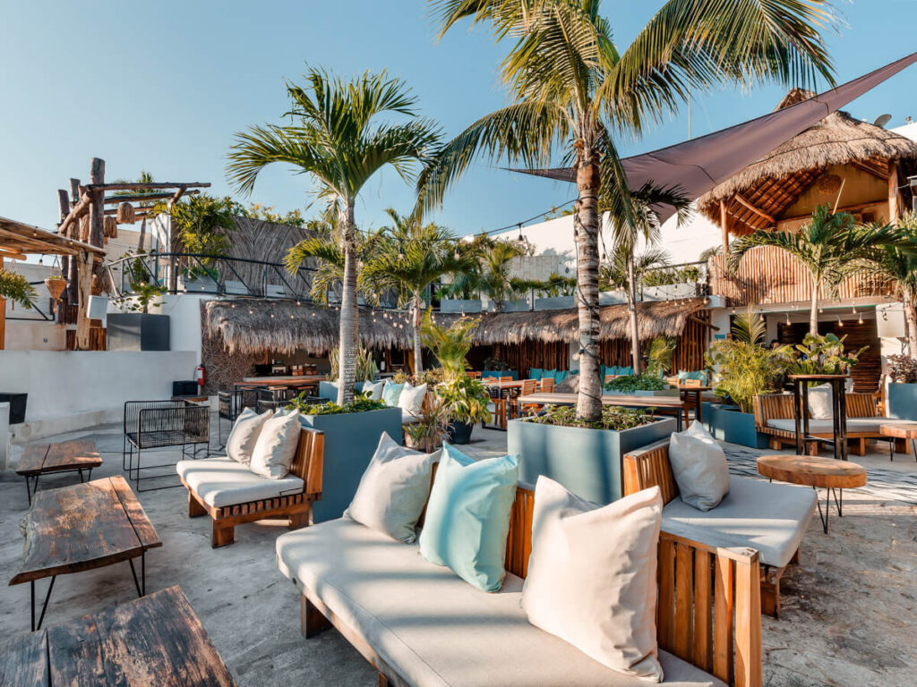 Comfortable beach loungers on the sand in Mayan Monkey Hostel in Tulum.