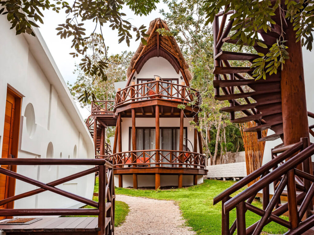 A unique A-frame hotel building with a minimal wooden design at MÍA Bacalar Luxury Resort & Spa.