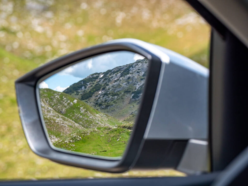 The reflection of a mountain in a car wingmirror on the Durmitor Ring Road.