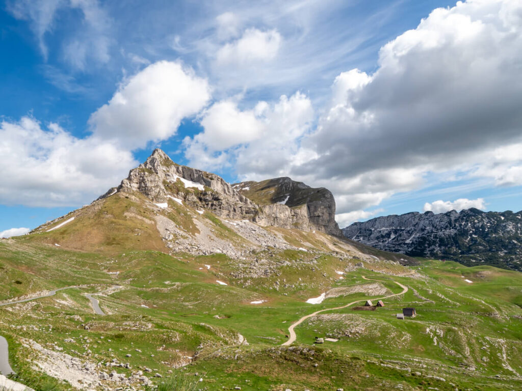 The winding Durmitor Ring Road through Sedlo Pass with views of the twin peaks of Sedlena Greda.