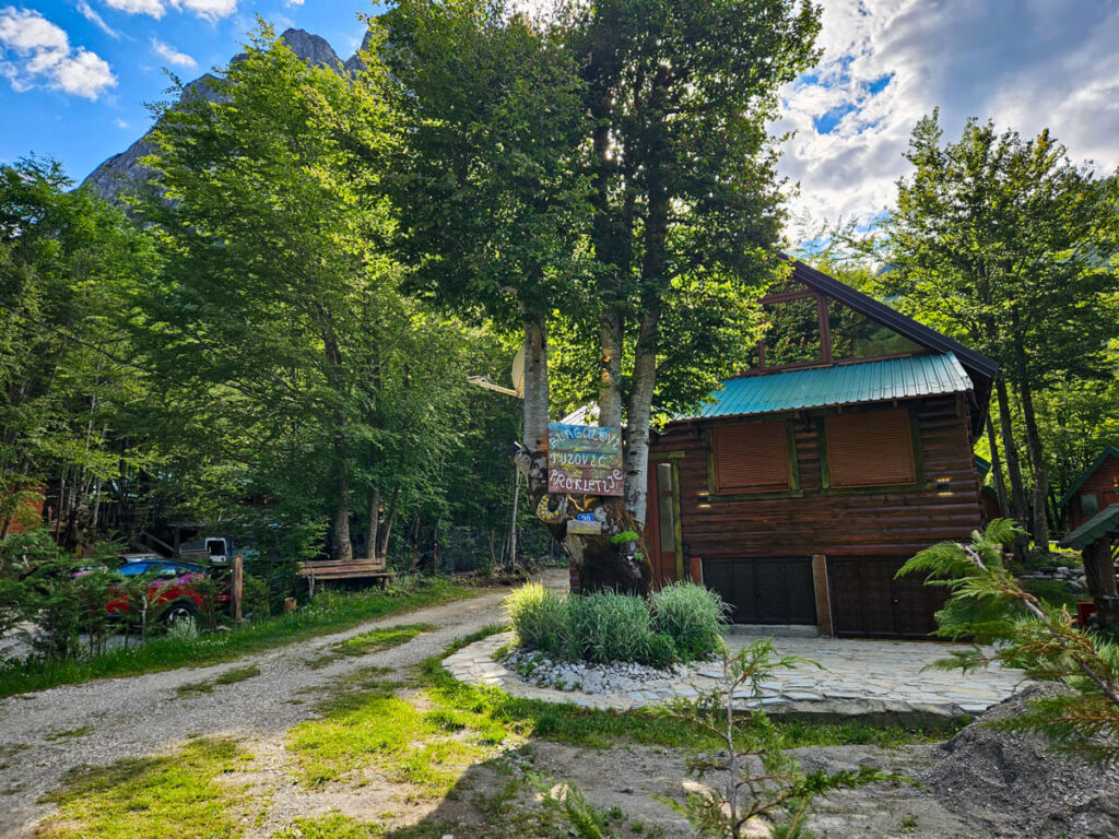 The wooden exterior of Bungalows Prokletije Tuzović, a guesthouse in the Grebaje Valley.