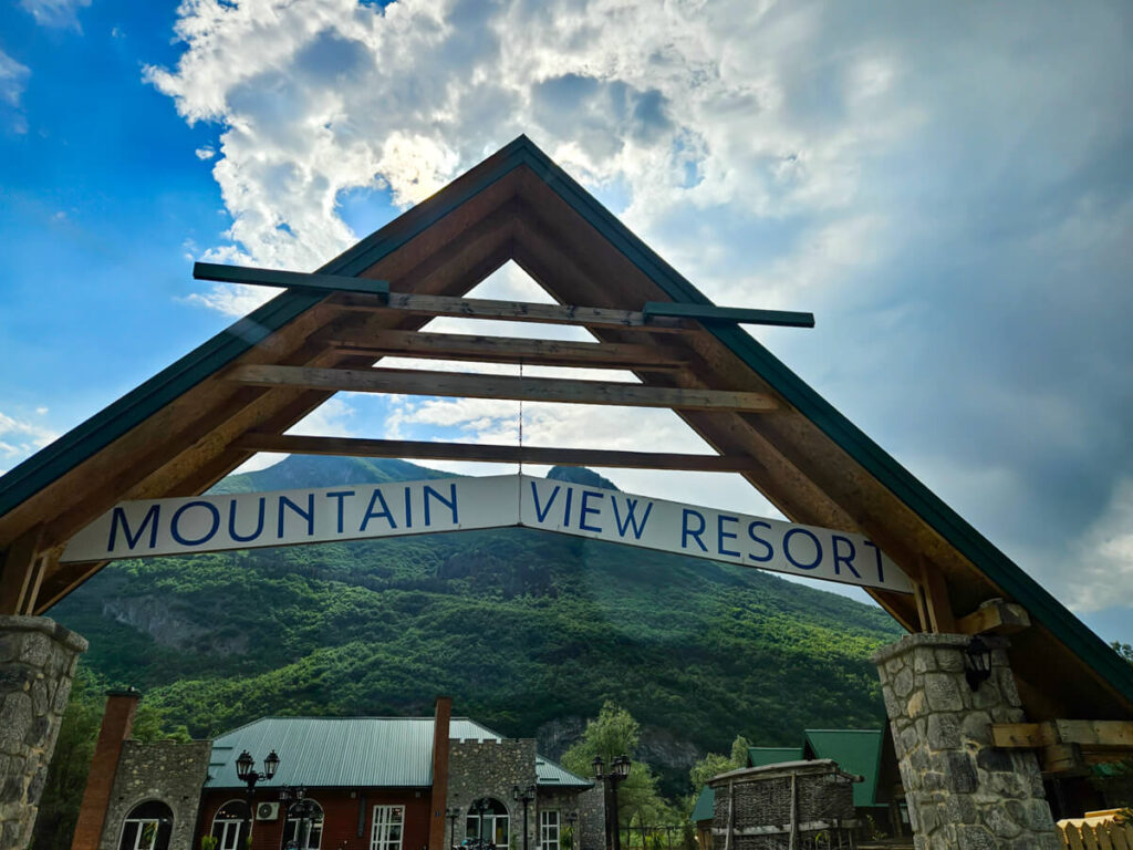 A wooden arch forming the entrance to the Mountain View Resort near Vusanje in Montenegro.