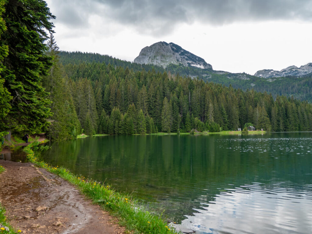 The curved shore of the Black Lake in Durmitor National Park, backed by Međed Peak.