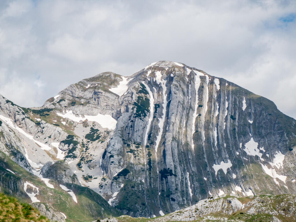 The dramatic grey layers of Prutaš, a peak on the Durmitor Ring Road.