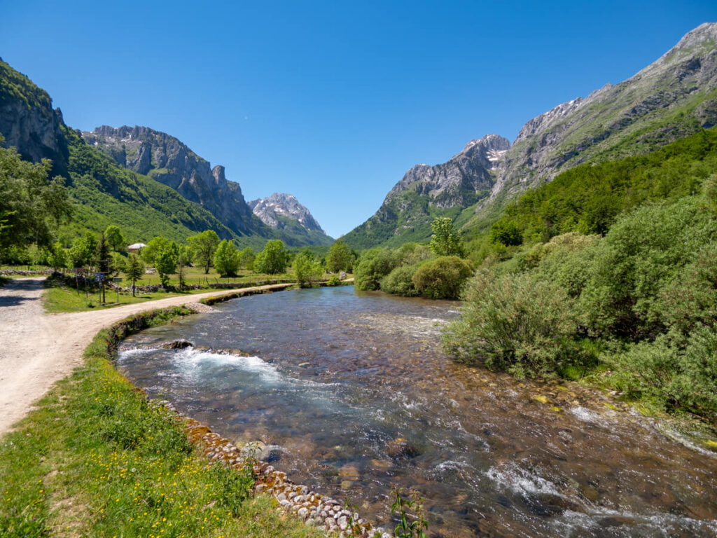 A gushing river winding through the mountains of the Ropojana Valley in Montenegro.