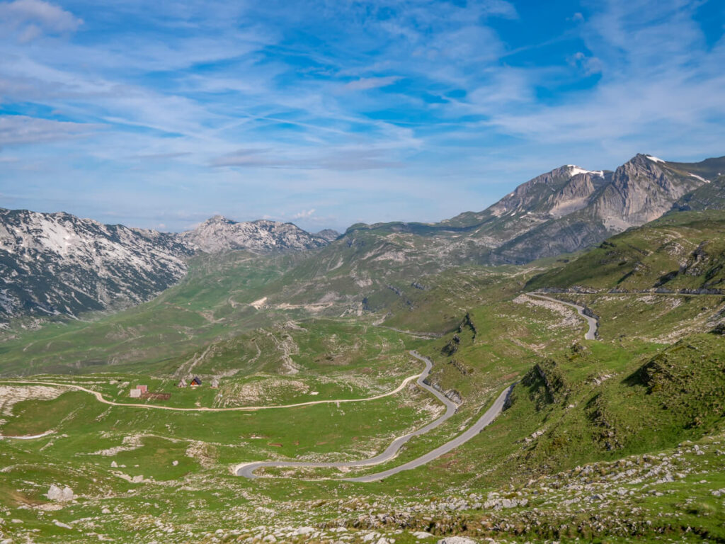 A snaking section of the Durmitor Ring Road switchbacking up a valley in Durmitor National Park.