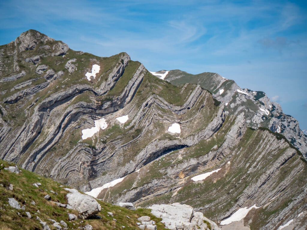 The dark wavy layers of rock on Sareni Pasovi, seen from the Bobotov Kuk hike in Durmitor National Park.