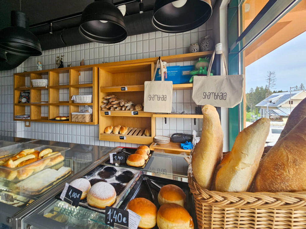 Pastries, breads, and cakes on display in Shambhala Bakery in Žabljak.