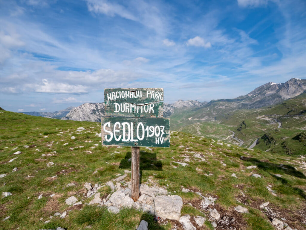 A green sign indicating the Sedlo Pass on the Durmitor Ring Road.