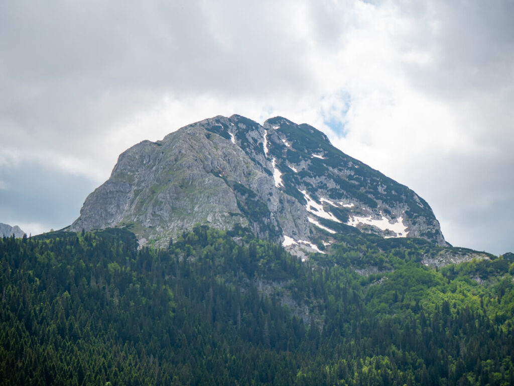 The dramatically dark top of Međed Peak looming over the Black Lake in Durmitor National Park.
