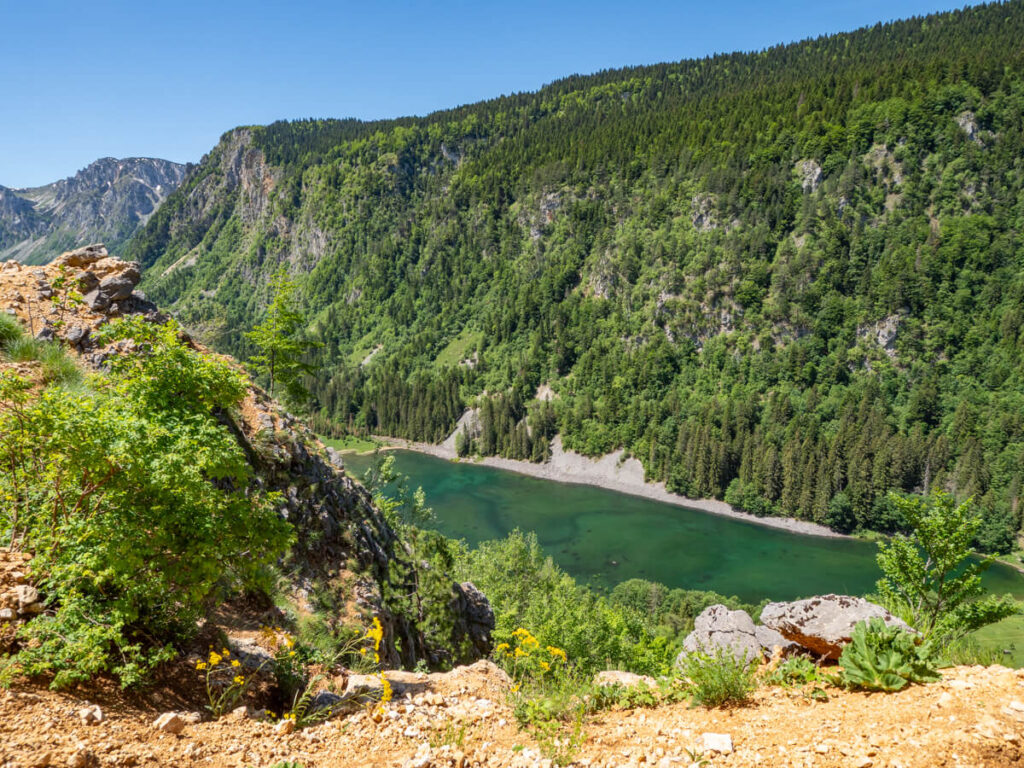 The green Sušičko Lake leading into a valley in Durmitor National Park.