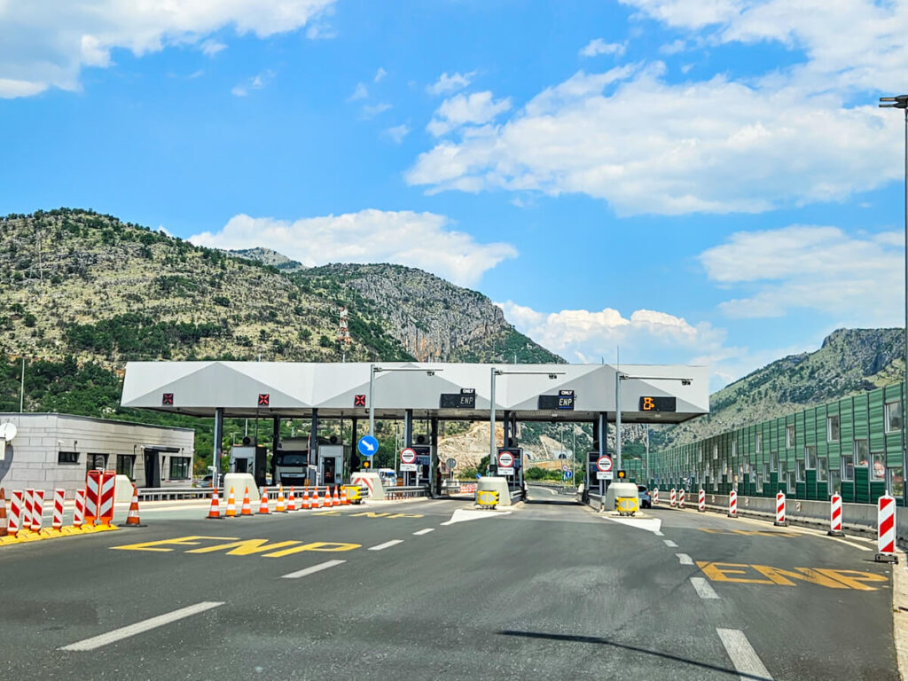 A toll on a motorway in Montenegro, where vehicles line up to pay for their ticket.