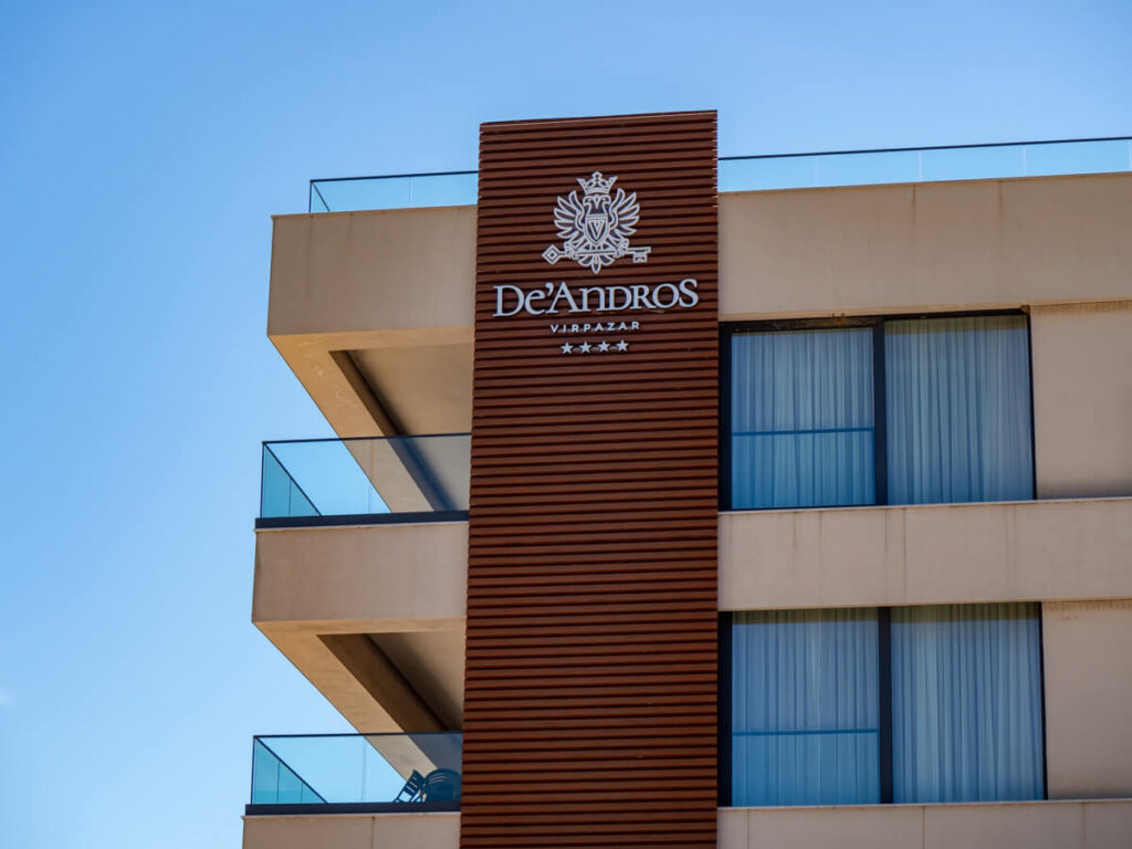 The logo of Hotel De'Andros on the corner of the hotel Virpazar.