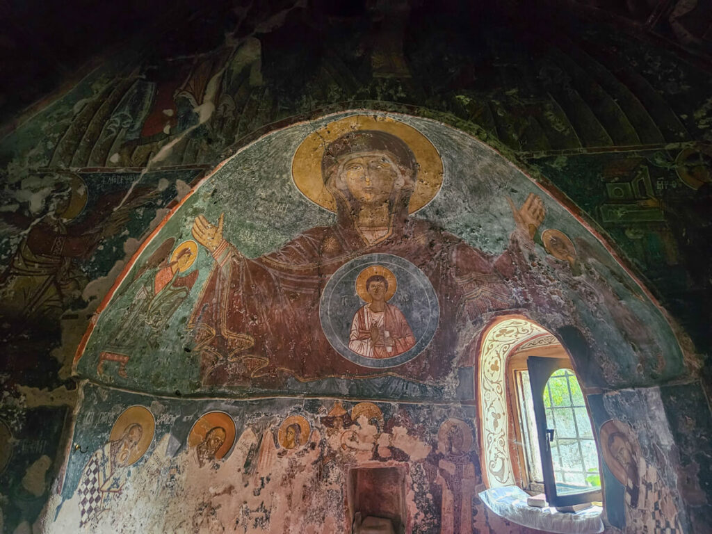 Impressive and well preserved frescoes inside the church at Kom Monastery.