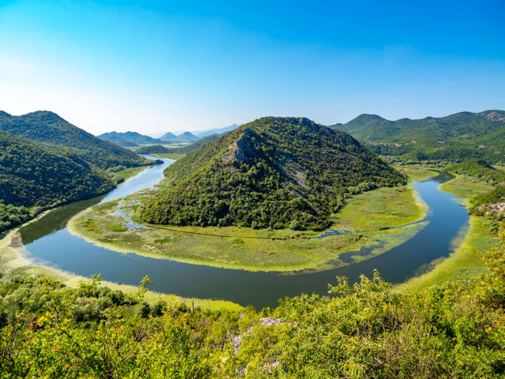 The iconic horseshoe bend of Pavlova Strana near Rijeka Crnojevića, a gateway to Lake Skadar National Park.