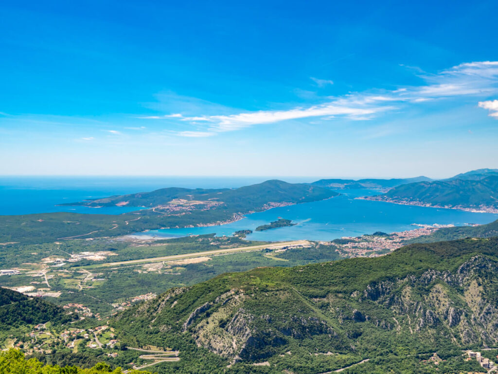 The expansive Bay of Kotor and Luštica Peninsula behind a tiny winding road, the Kotor Serpentine.