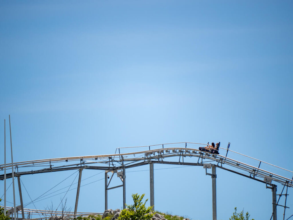 A cart on the alpine coaster at the Kotor Cable Car on a track.