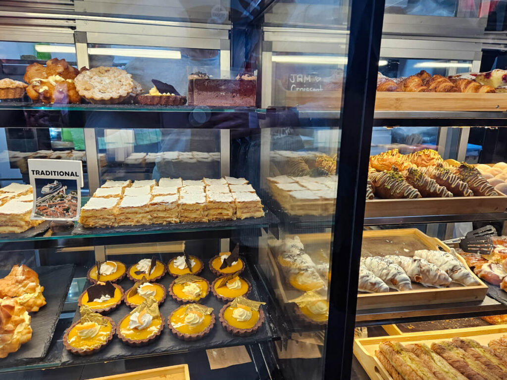 A cabinet of cakes including krempita in a bakery in Kotor.