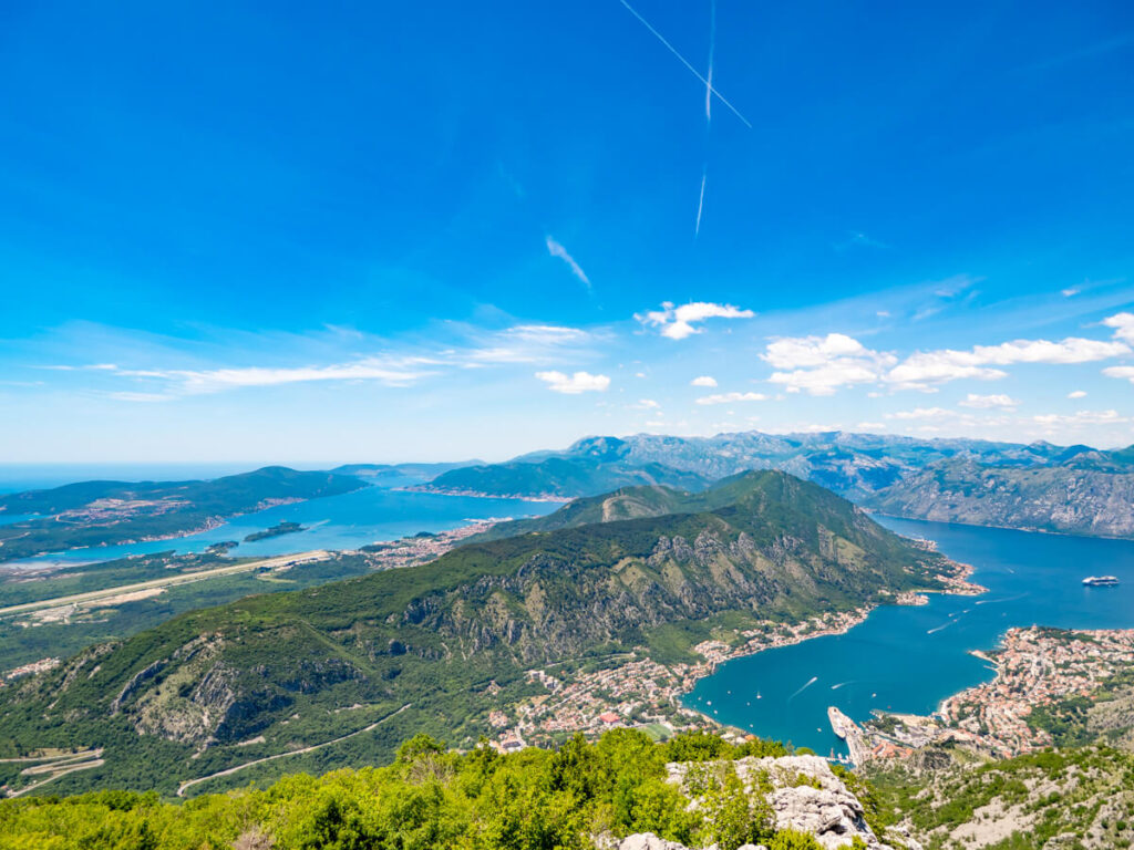 The Vrmac Peninsula jutting out into the bright blue Bay of Kotor.