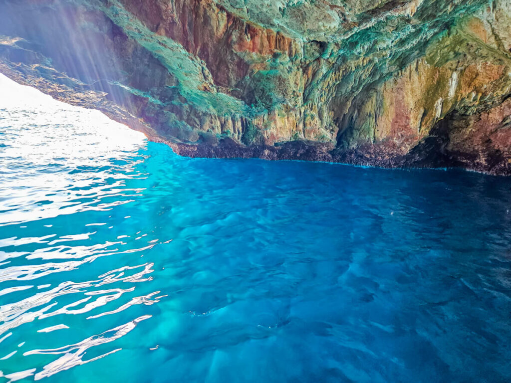 The bright blue waters inside the entrance to the Blue Cave in Montenegro.