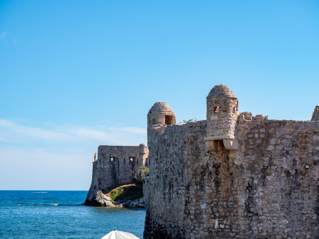 Turrets overlooking the sea on the stone walls surrounding Budva Old Town.