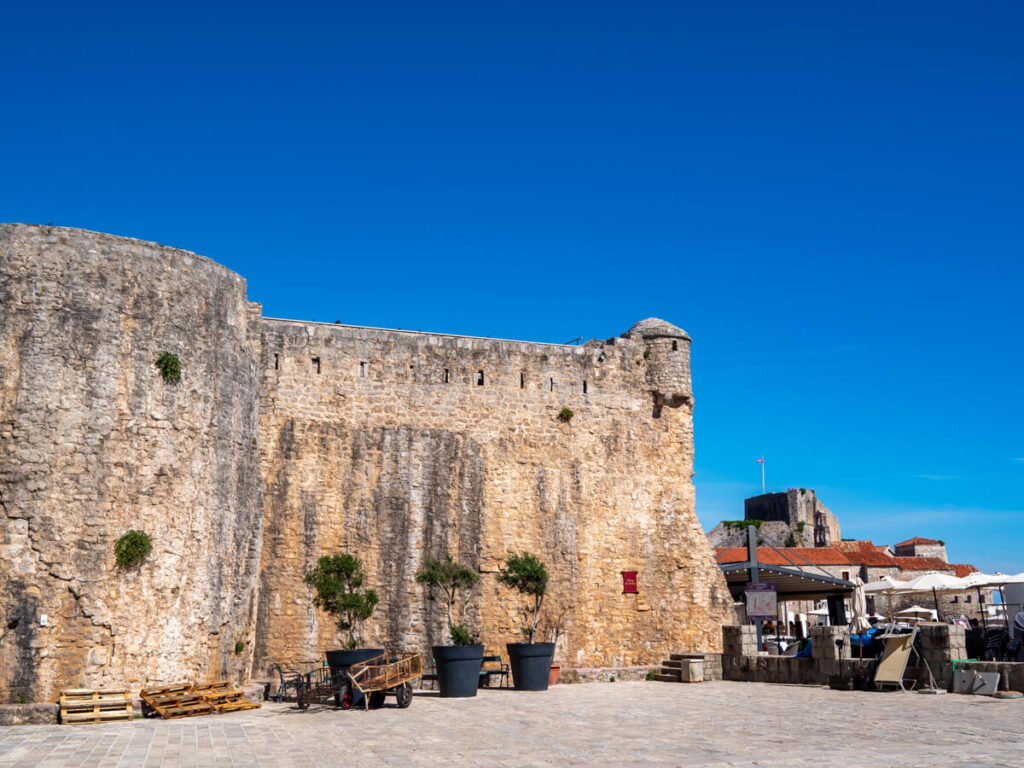 A large stone wall encircling Budva Old Town.