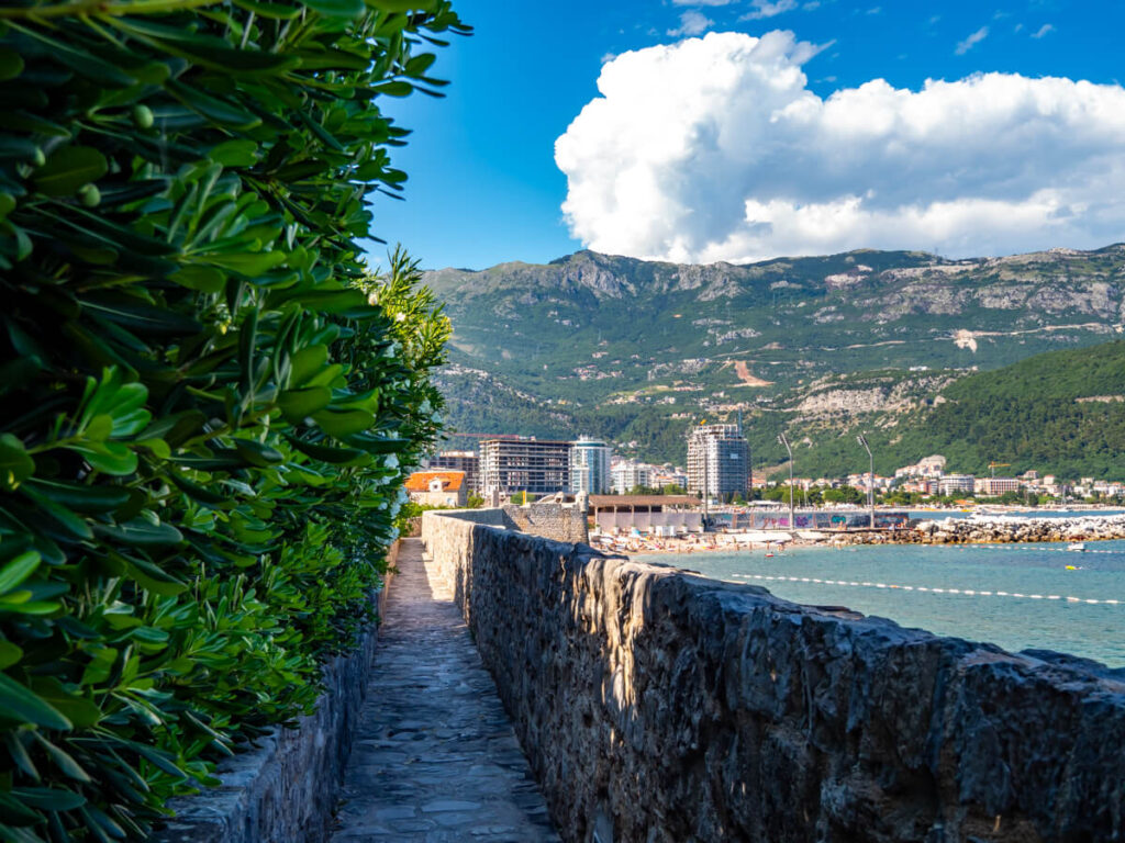 A path leading along the walls of Budva's Old Town overlooking the town.