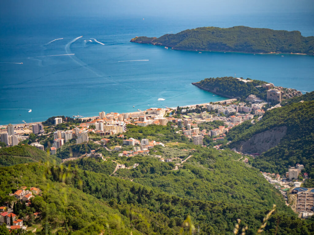 A view of Budva sprawling along the coast, viewed from the main road.