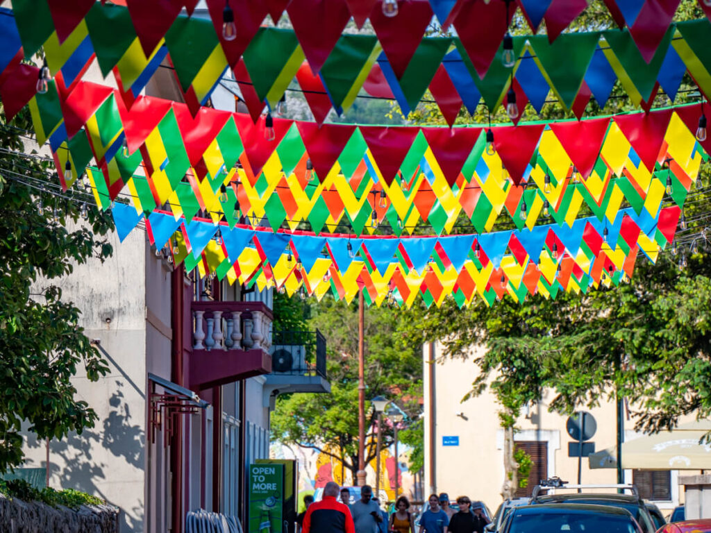 Multi-coloured bunting lining a street in Cetinje.
