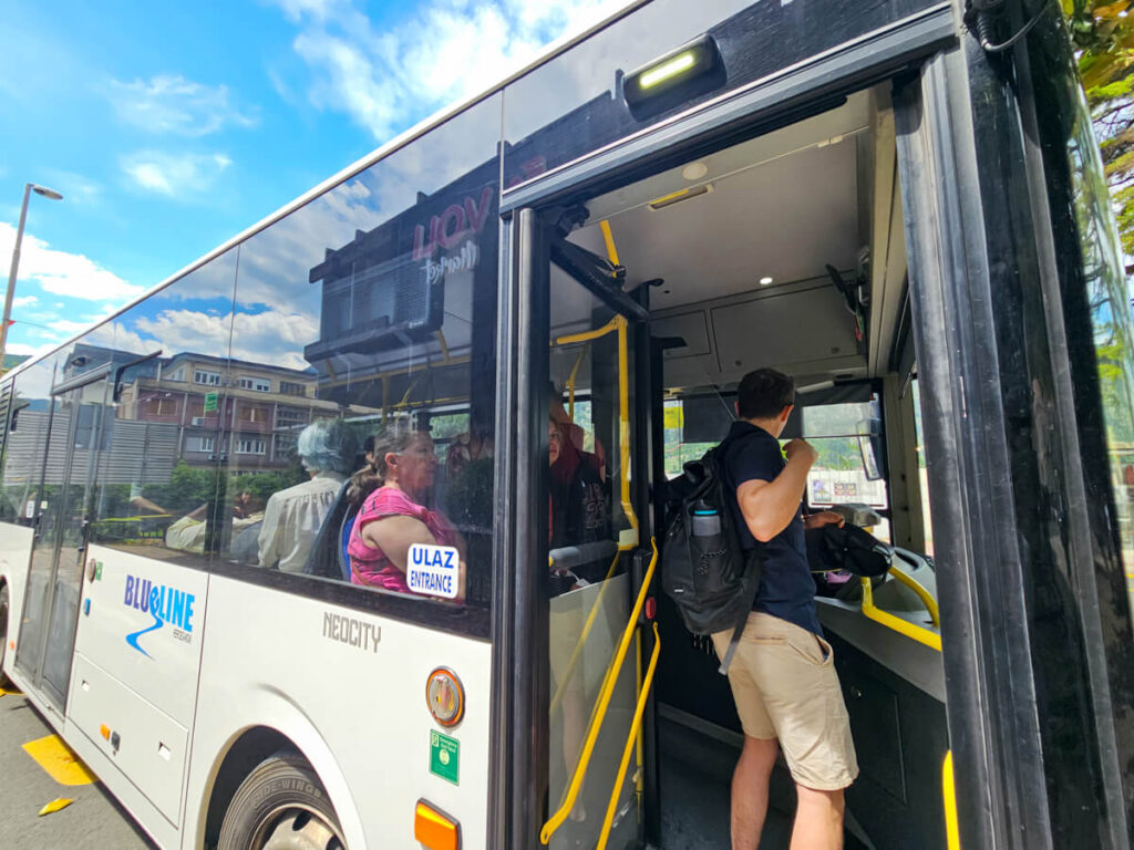 Dan boarding a public bus to Perast in Kotor.