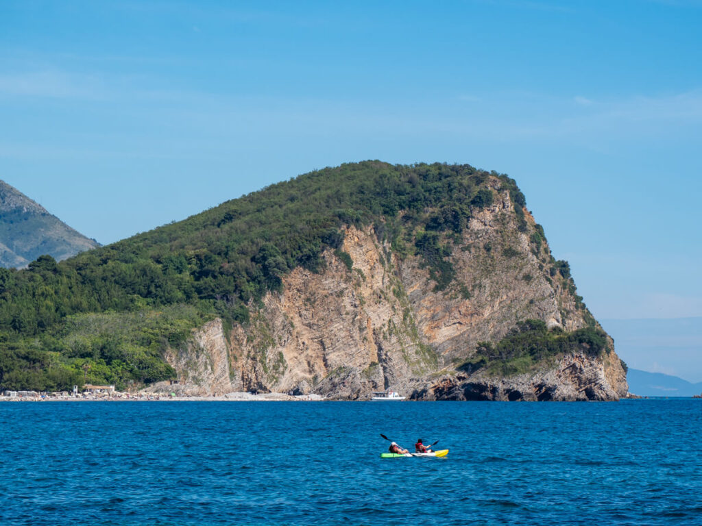 A tandem kayak in front of Sveti Nikola Island in Budva, Montenegro.