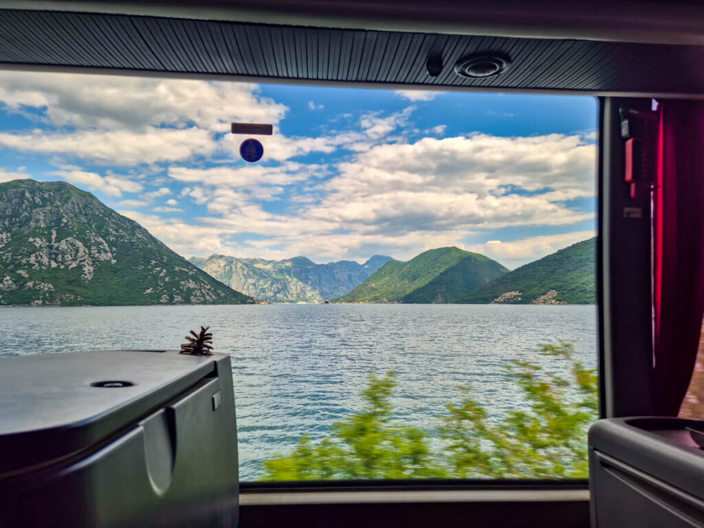 The verdant mountains of the Bay of Kotor, photographed from a bus window.